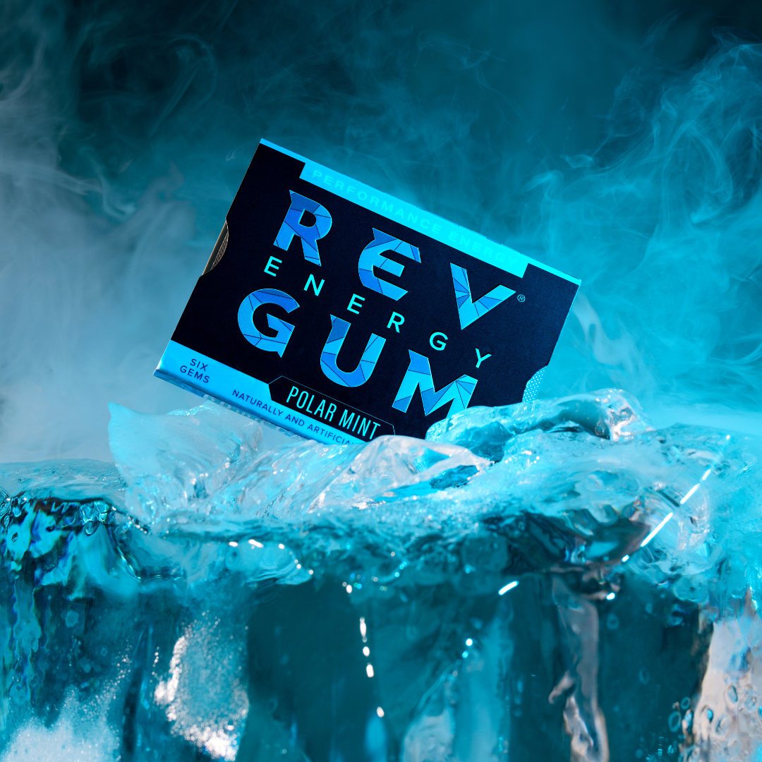 REV Energy Gum packaging with polar mint flavor on a blue and white smoke background